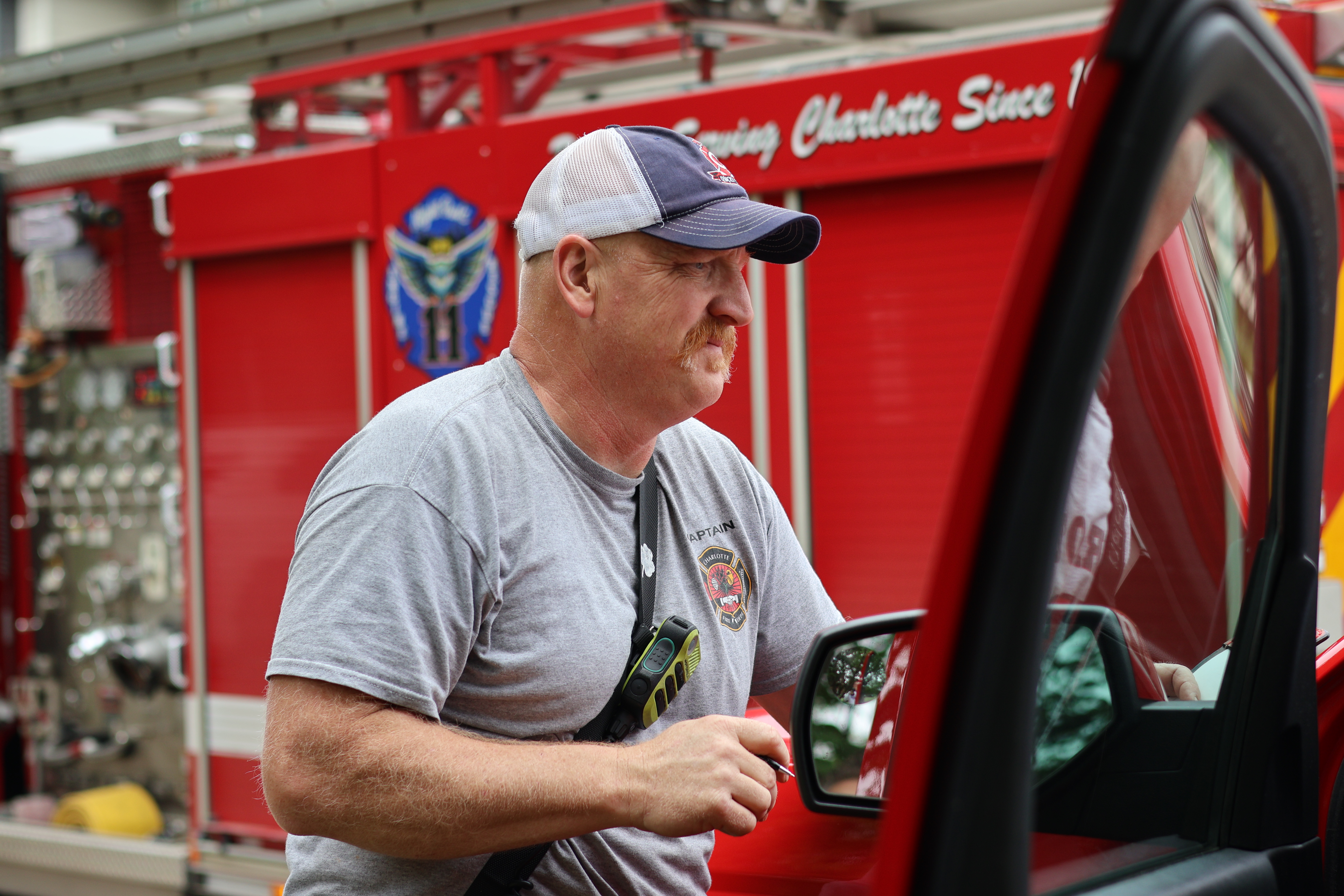 Feneis prepares alongside Charlotte firefighters during an emergency response in Charlotte.