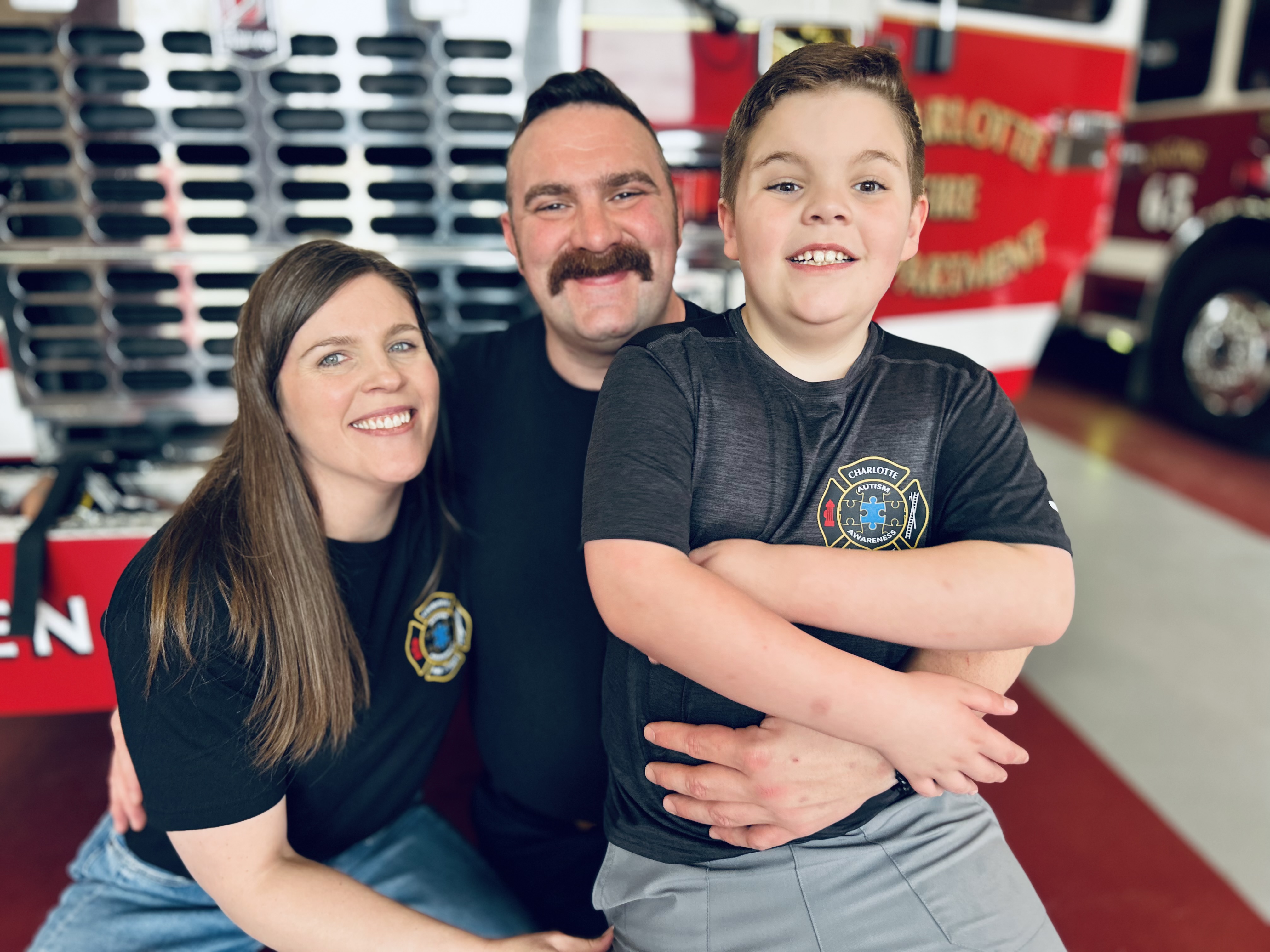Firefighter Nate Powell and Sierra Powell share a family moment with their son, Benjamin,