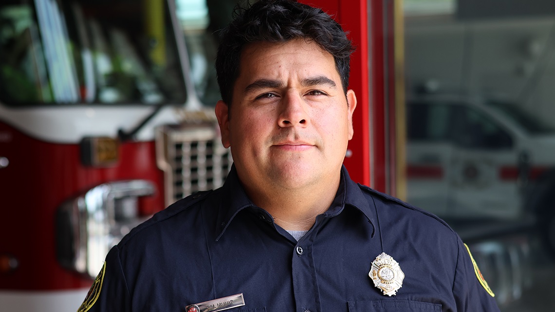 Charlotte Fire Engineer Pedro Muniz stands at Firehouse 11, where he serves on Rescue 11 as part of Charlotte Fire’s special operations response.