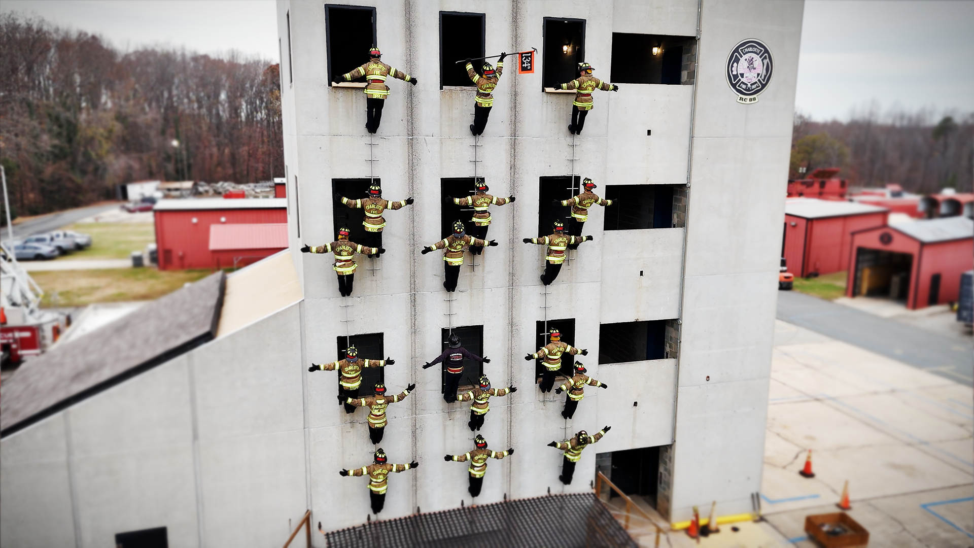 Recruit Class 134 fills the training tower for their traditional group photograph, a moment that marks their shared accomplishment on the pompier ladder. 