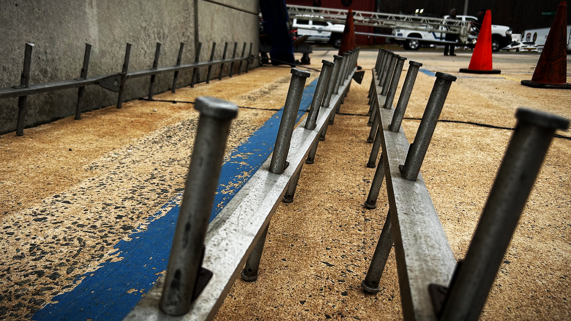 Rows of rungs lie ready for training, their narrow spacing reminding recruits that every movement on the pompier ladder must be deliberate. 