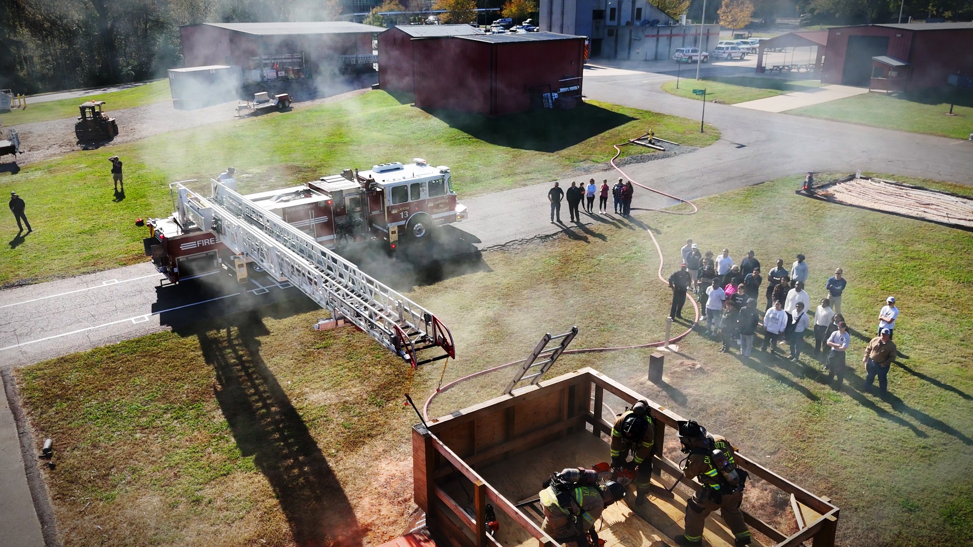 The Charlotte Fire Training Academy open house showcased the heart of firefighting. Dozens of attendees witnessed the teamwork and courage that define the profession.