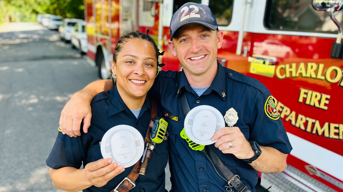 Engineer Venessa Roy and Captain Joshua Brown take a moment during installations to show the tools they’re using to improve safety, one home at a time.