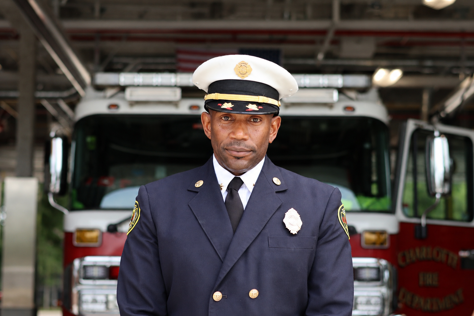 Brown wears the white chief officer cap that marks his promotion to division chief.
