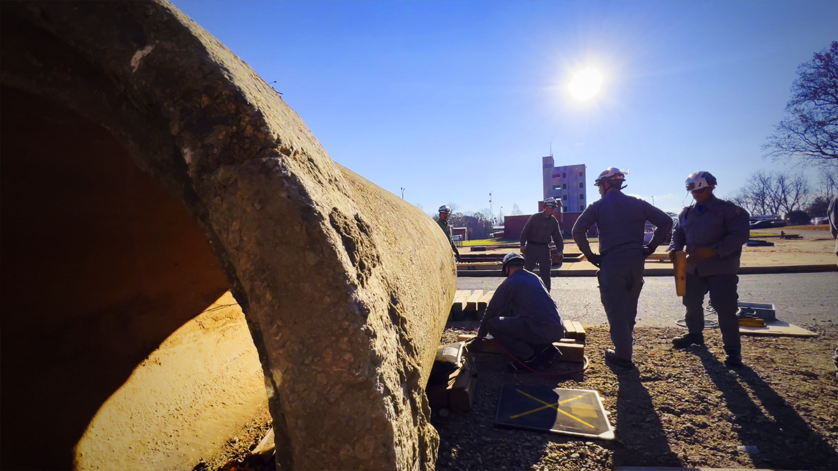 USAR trainees work under the watchful eye of Charlotte Fire instructors as they practice heavy lifting and moving techniques. These hands-on scenarios are designed to simulate real-world structural collapse challenges.