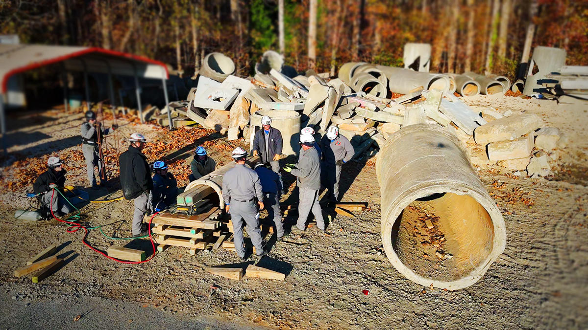 Aerial views of the training site reveal the complexity of the scenarios, designed to test every participant’s skills. These controlled environments prepare firefighters for unpredictable real-world conditions.