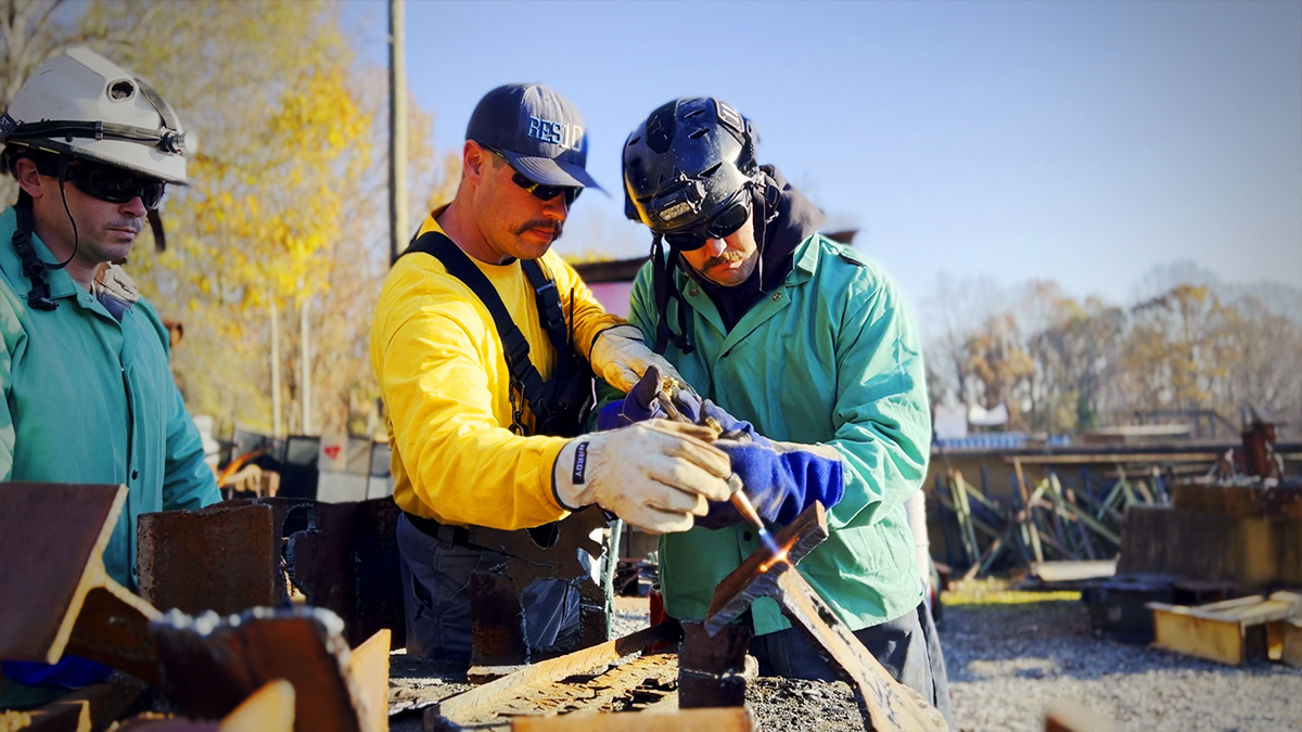 Firefighter Bradley Blackmon demonstrates precision metal cutting as part of the advanced USAR course. This essential skill prepares responders to navigate through collapsed debris and reach survivors.