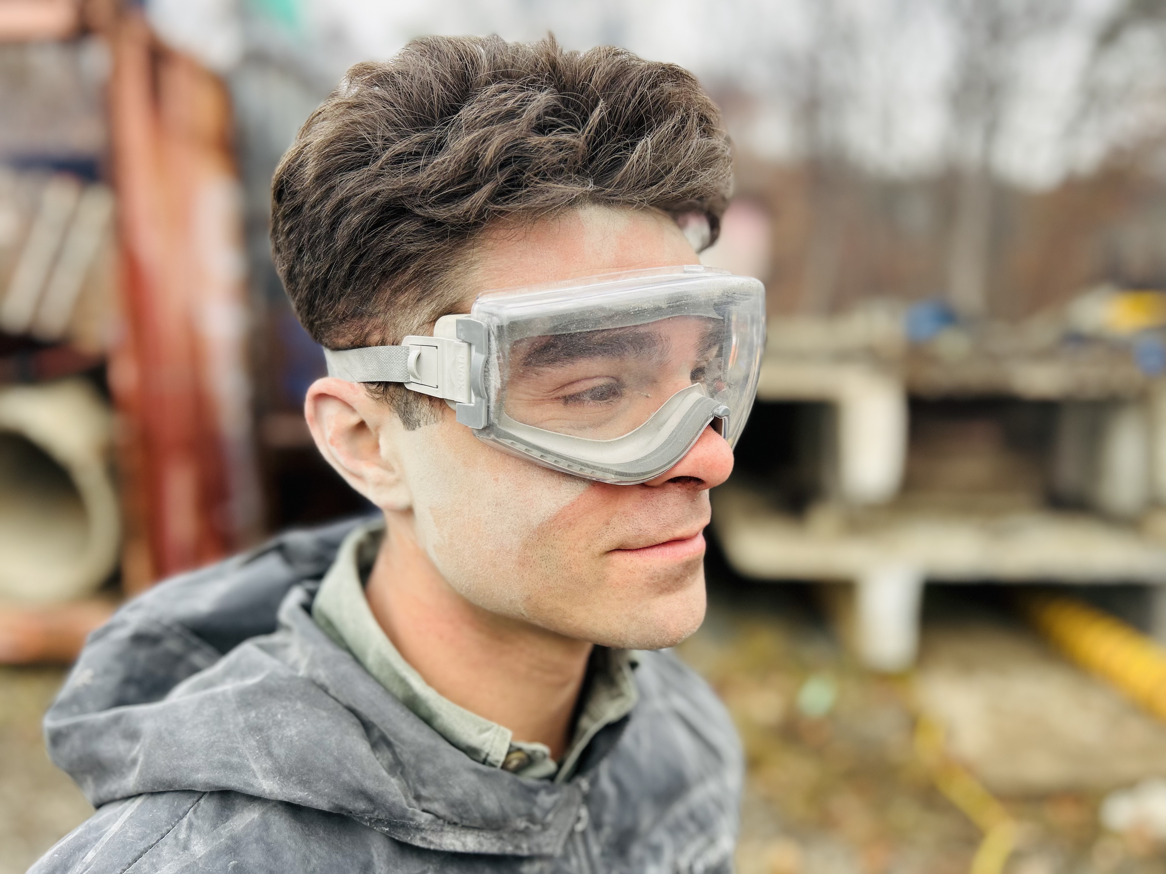 Top: Charlotte Firefighter Dillan Parks takes a short break during a full day of breaching and breaking training at the Charlotte Fire Training Academy. Below: