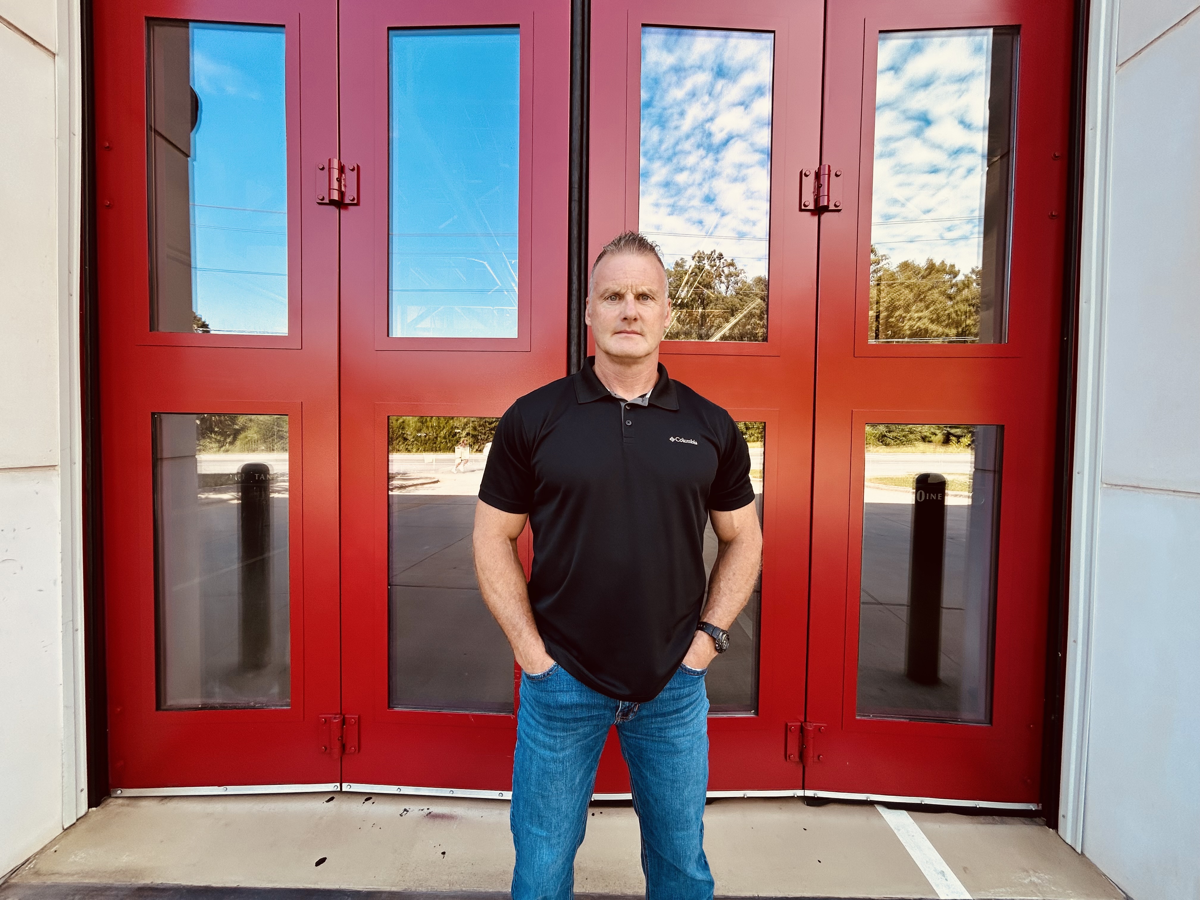 With firehouse bay doors as the backdrop, Walker’s portrait highlights the lasting connection between firefighters and the places they served. 