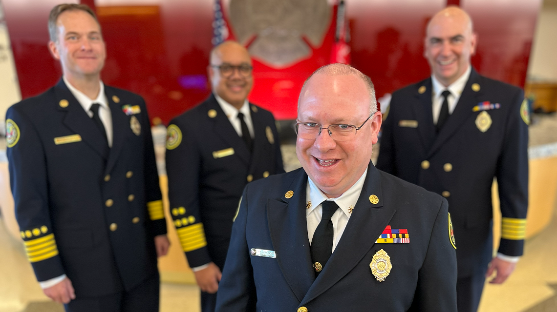 Deputy Chief Wike Graham is pictured in the foreground with Charlotte Fire command staff members behind him at department headquarters.