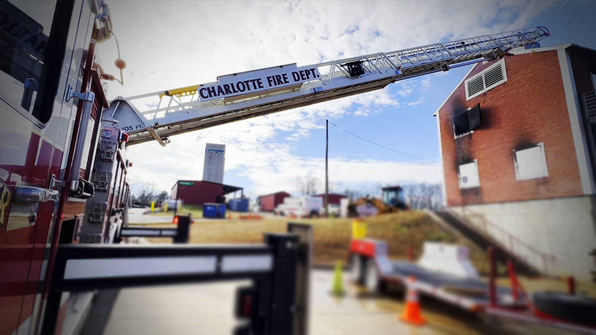Charlotte Fire Ladder extends into position at the Training Academy, preparing crews for real-world tactical scenarios.