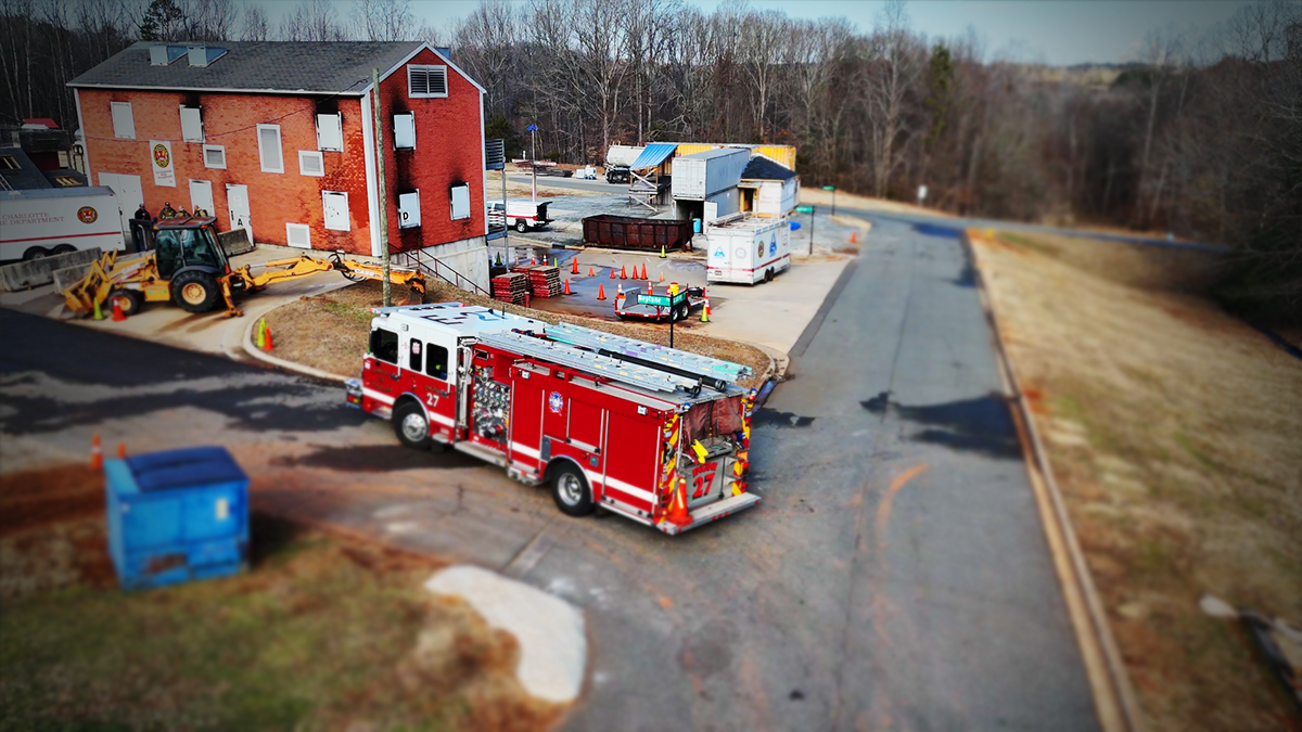 Engine 27 is staged at the Charlotte Fire Training Academy, where crews refine their skills and prepare for the challenges of urban firefighting. 