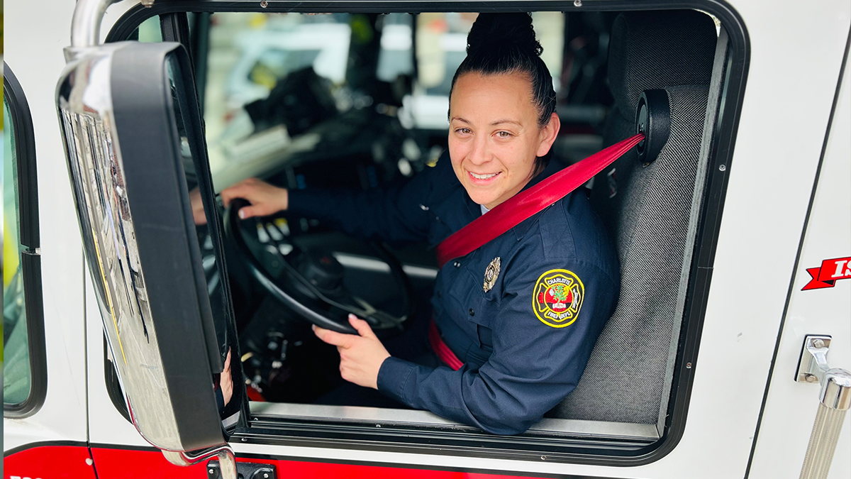 Engineer Michelle Jordon in the driver’s seat of her fire engine, ready to lead her crew with precision and expertise on every call. 