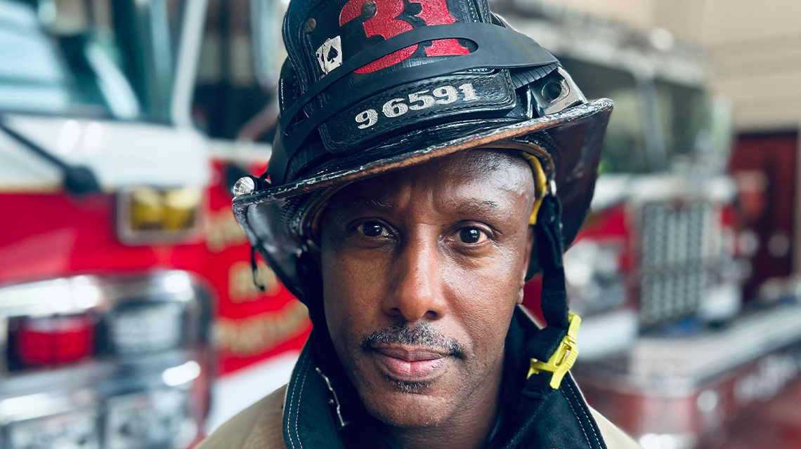 Mark Meylor inside Charlotte Firehouse 31, where his journey from cancer patient to advocate inspires his crew and the fire service. 