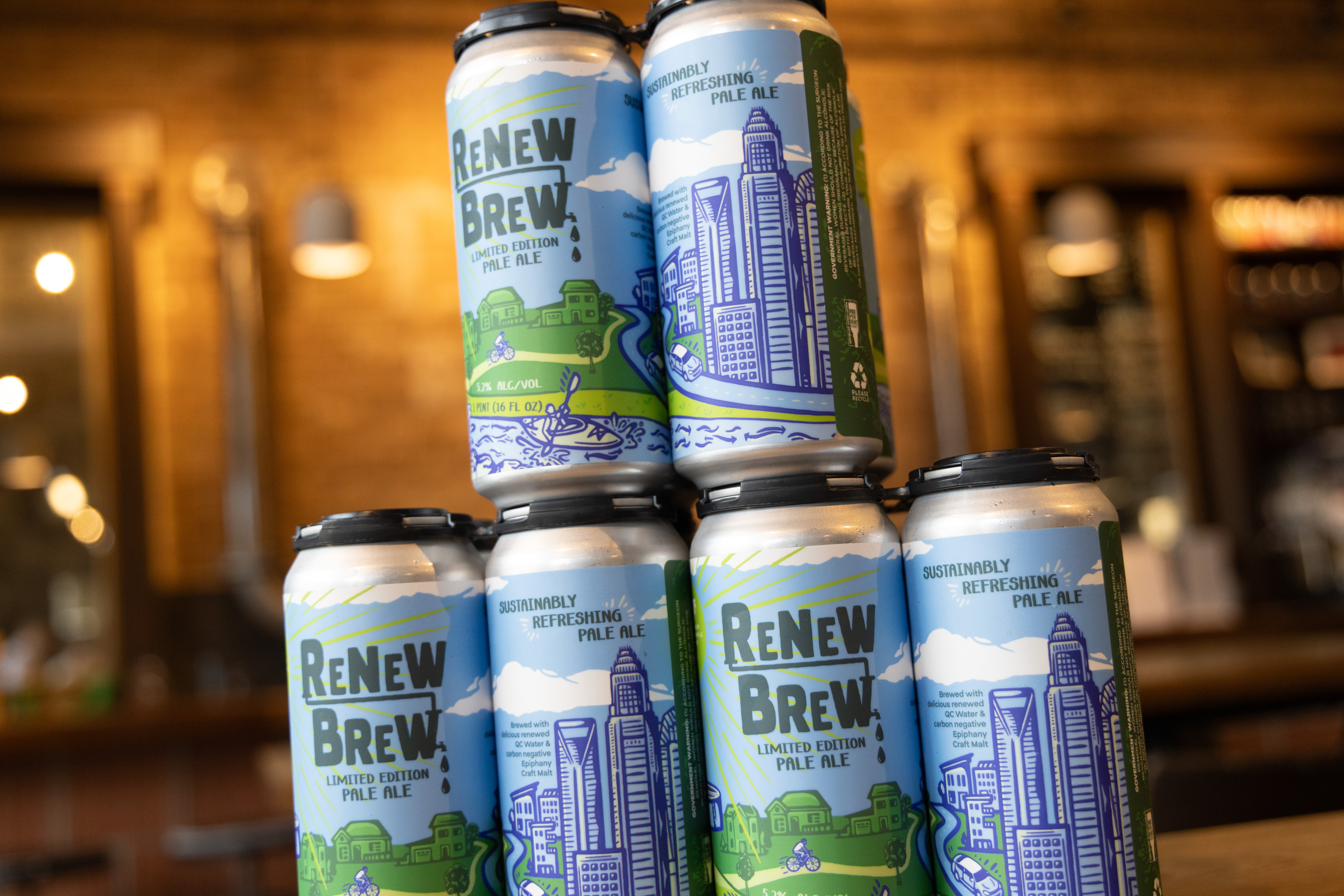Closeup of Renew Brew cans, featuring Charlotte’s skyline.