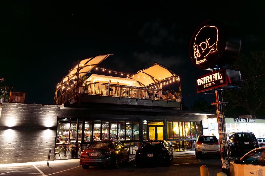 burial beer building at night