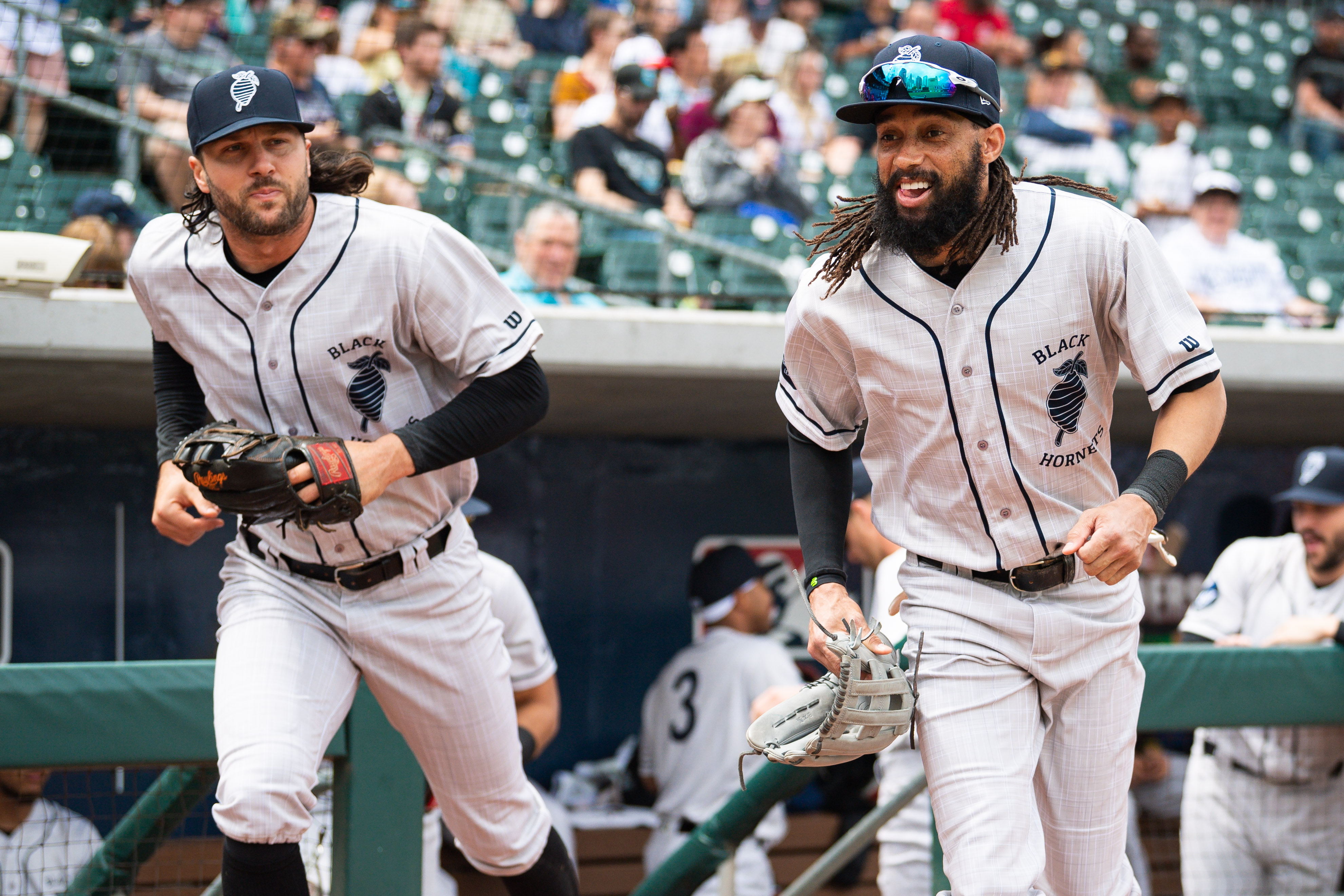 Two Charlotte Knights players in Black Hornets uniforms for Negro Leagues tribute night.