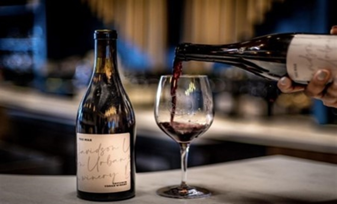 Wine being poured into a wine glass at Davidson Wine Company