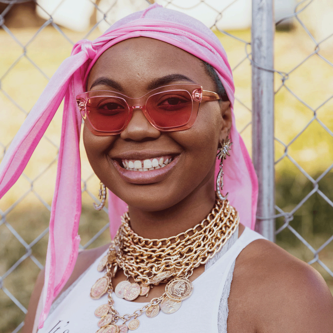 Black woman wearing pink durag