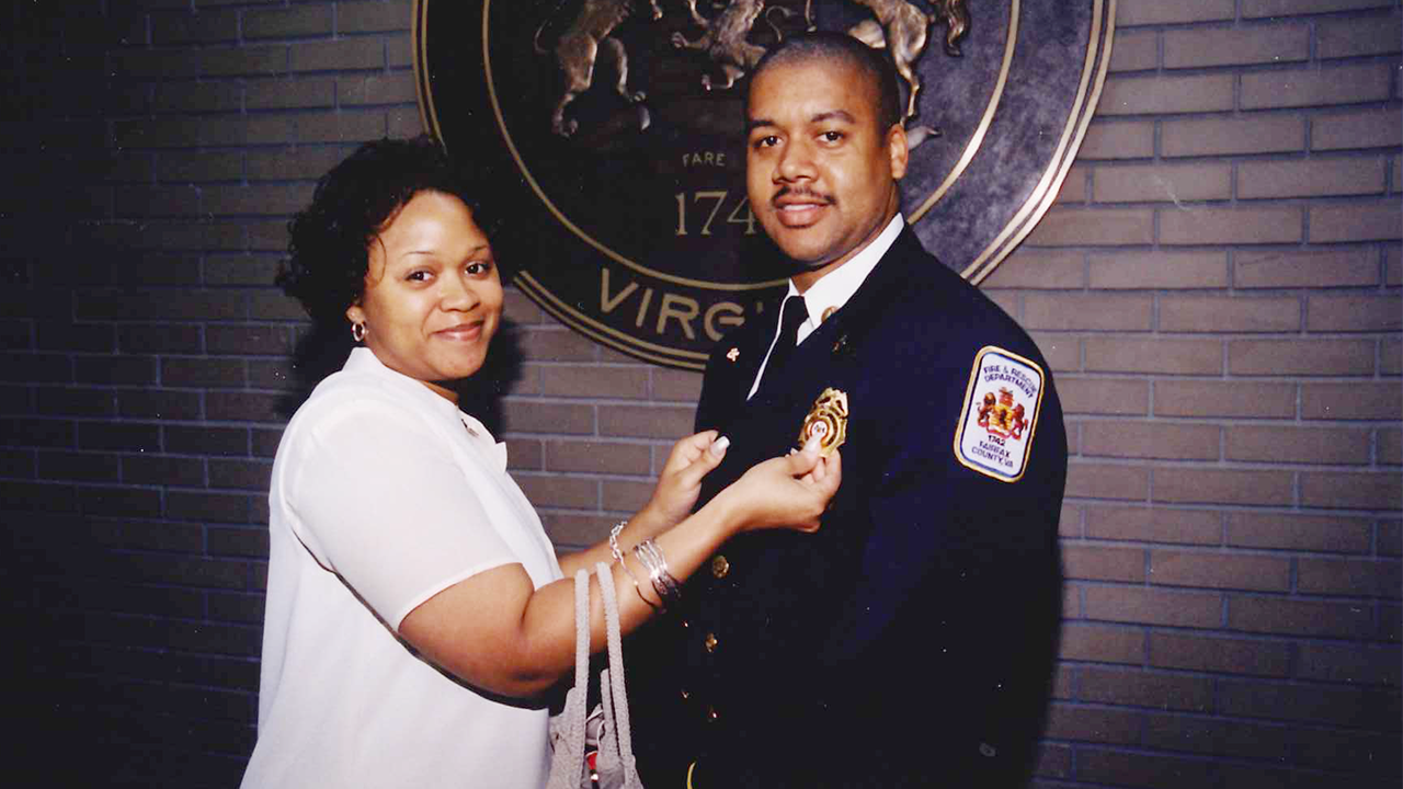 Charlotte Fire Chief Reggie Johnson with his wife, Angela when he was promoted to lieutenant in 2001.