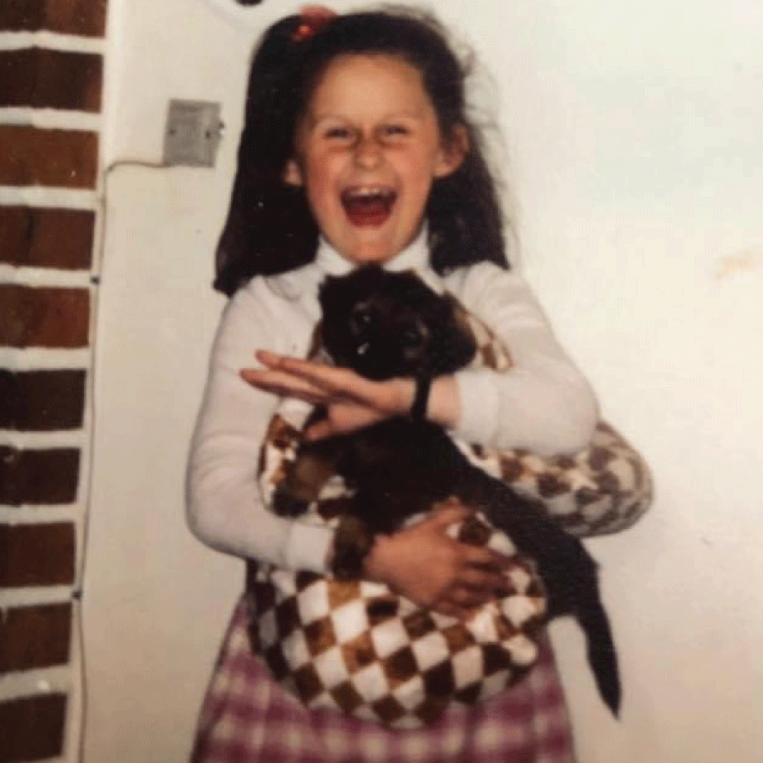 Julia Bulinska around five holding puppy