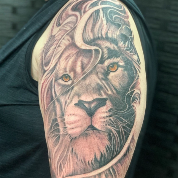 Black & gray realism tattoo of a lion by Prime