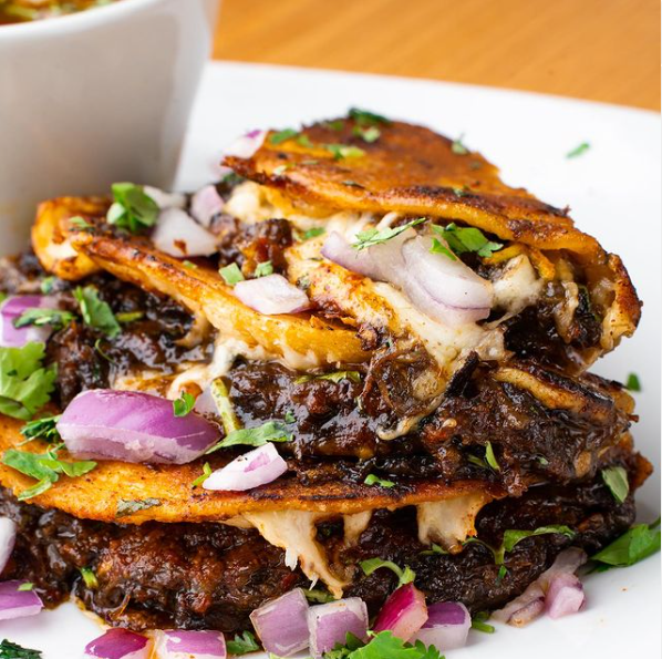 A plate of oxtail tacos from Mariah's Taco Spot.