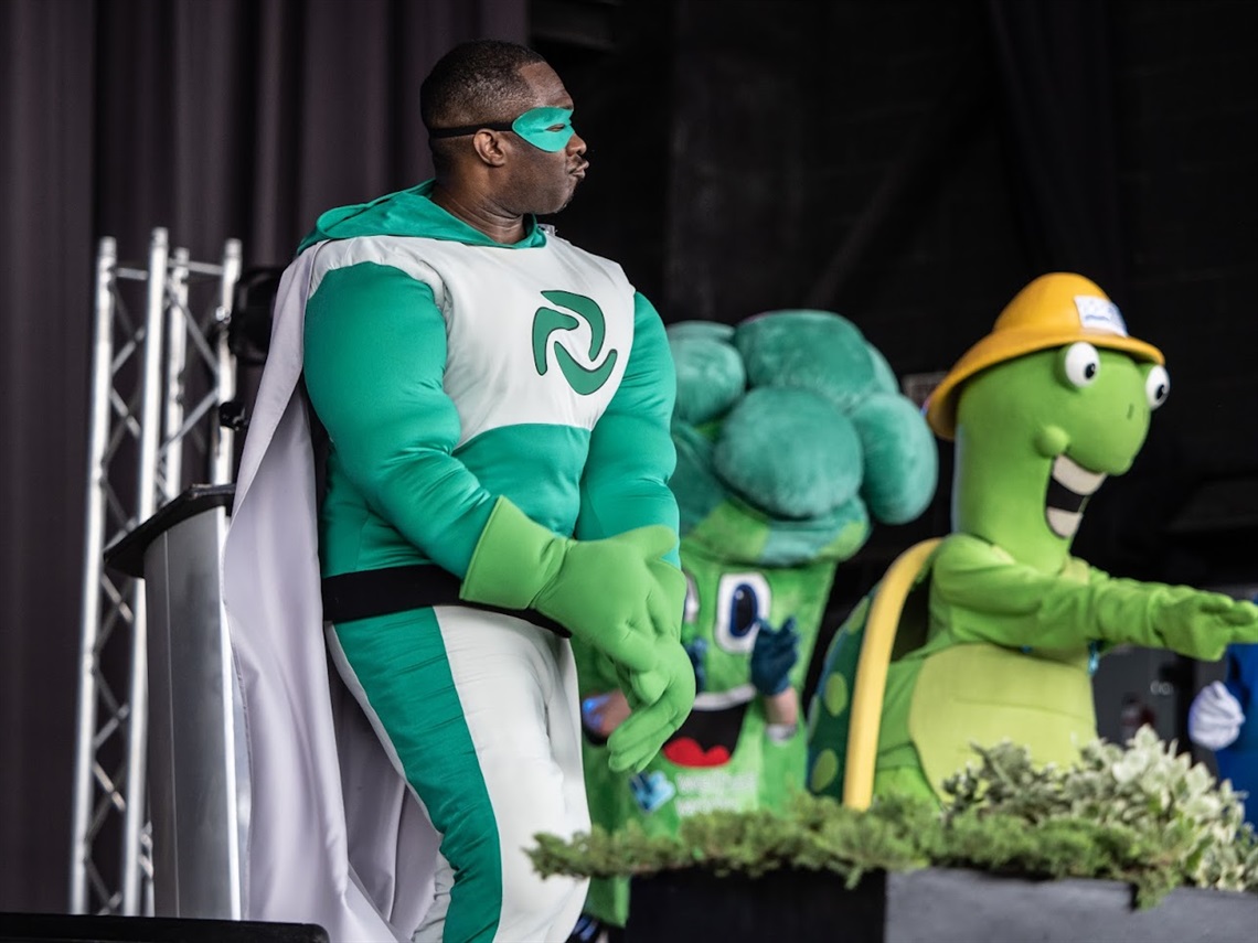 Recycling mascot dancing.