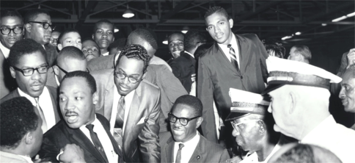 Martin Luther King, Jr. with Reginald Hawkins at Johnson C. Smith University in 1966.