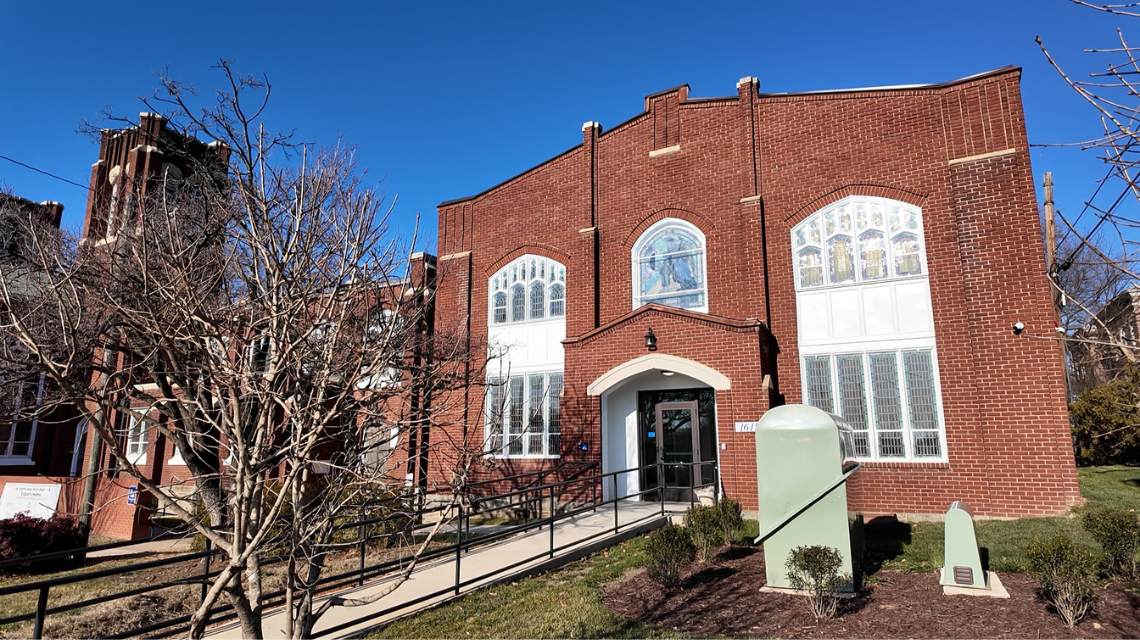 Exterior of Easter's Home, a Faith in Housing partnership. The building is brick.