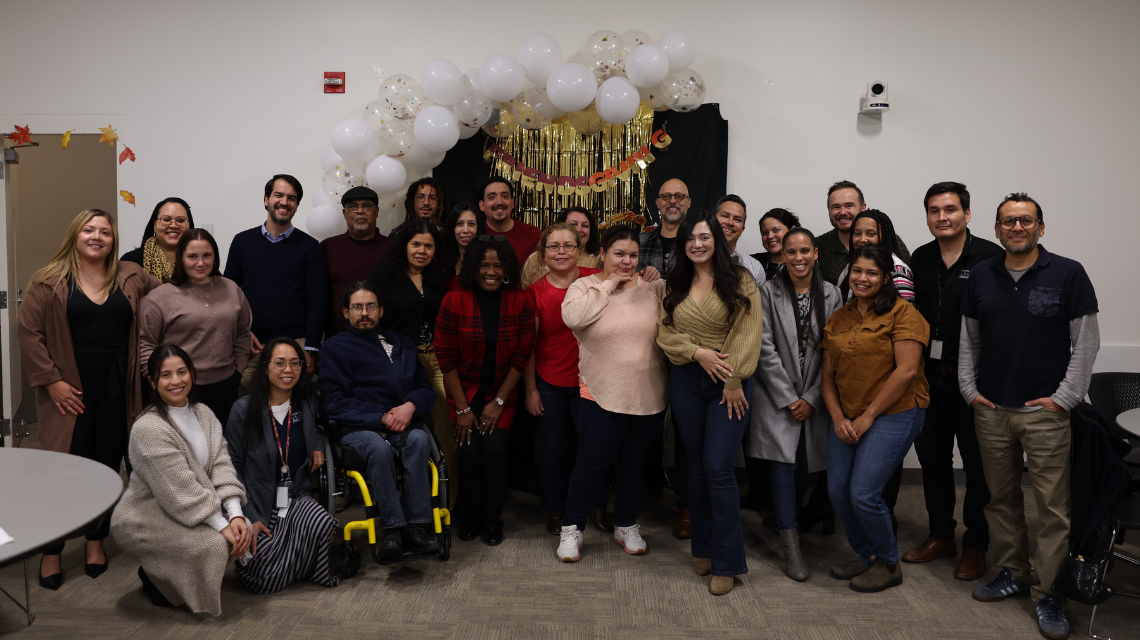 Charlatinos pose for a photo at a Friendsgiving event.