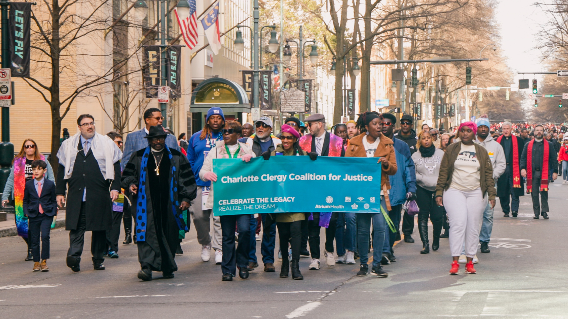 Charlotte Clergy Coalition for Justice members walk in the annual Martin Luther King Jr. parade through Uptown Charlotte.