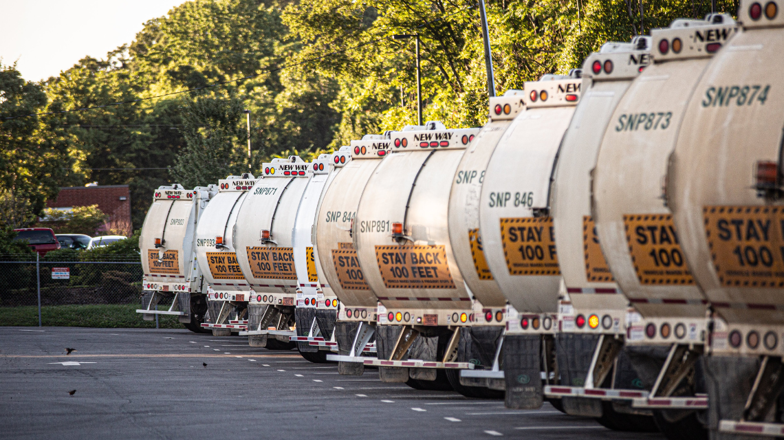 Collection trucks lined up ahead of service.