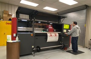 Transportation operations technician running the digital sign printer