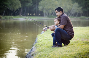 Father and child fishing together
