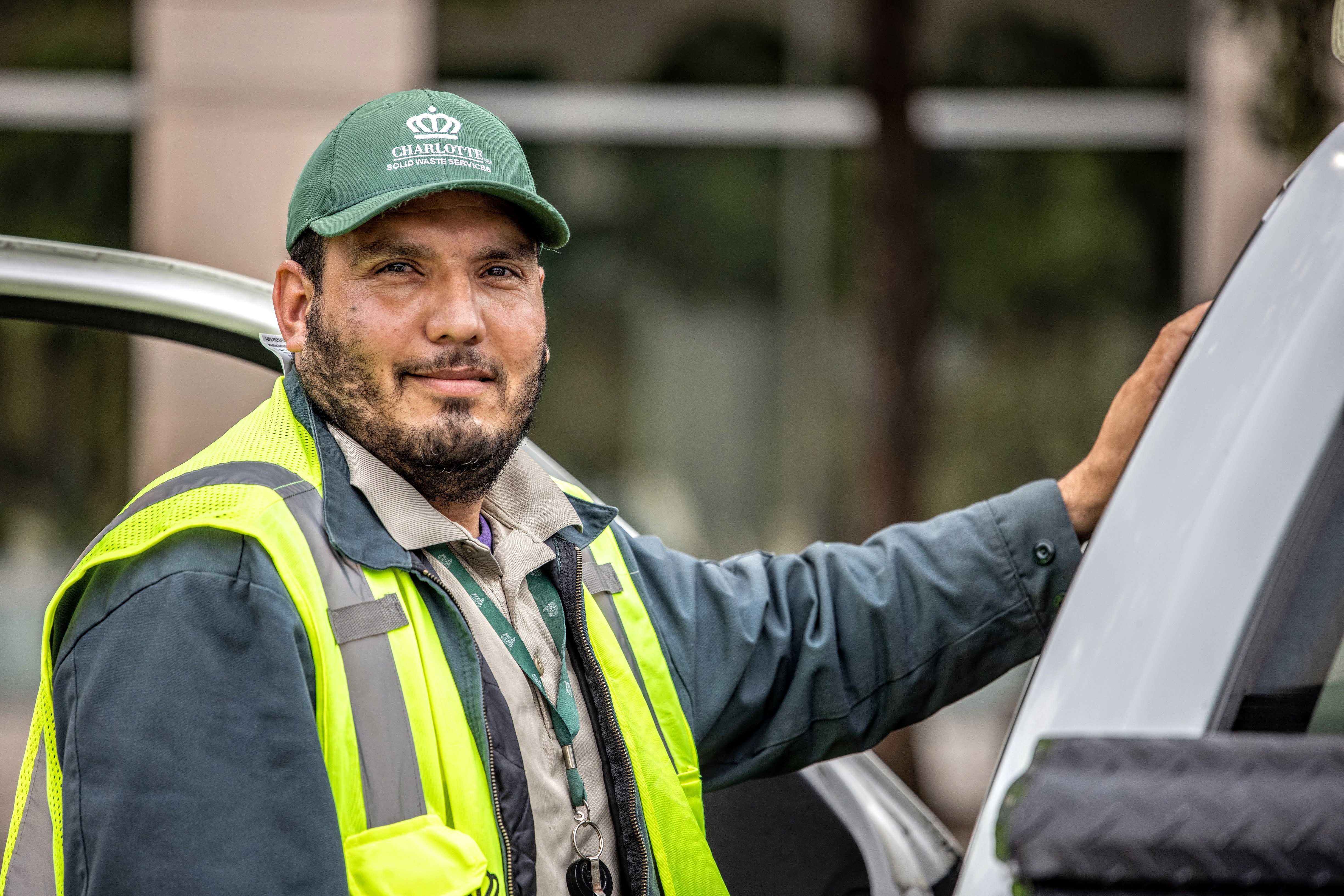 Solid Waste Services employee smiling at camera