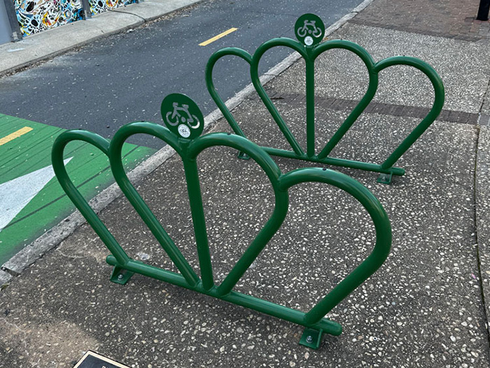 image of bicycle parking area in the shape of the crown logo