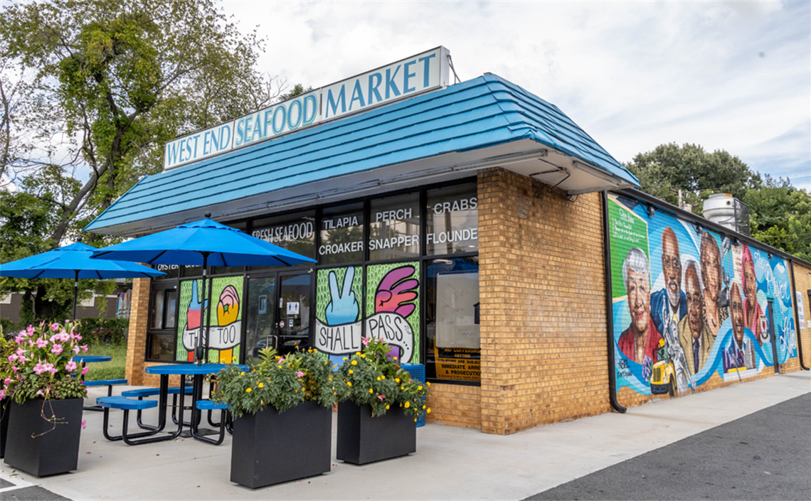 West End Seafood Market building with mural painted on the side.
