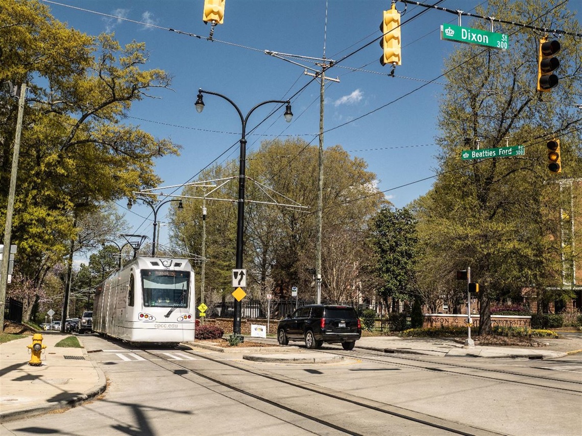 A street car traveling down the road